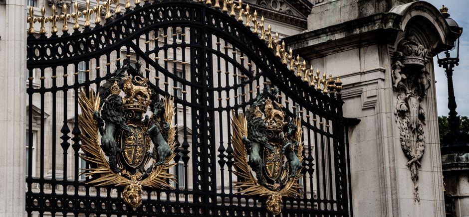 A closed iron gate set between two posts