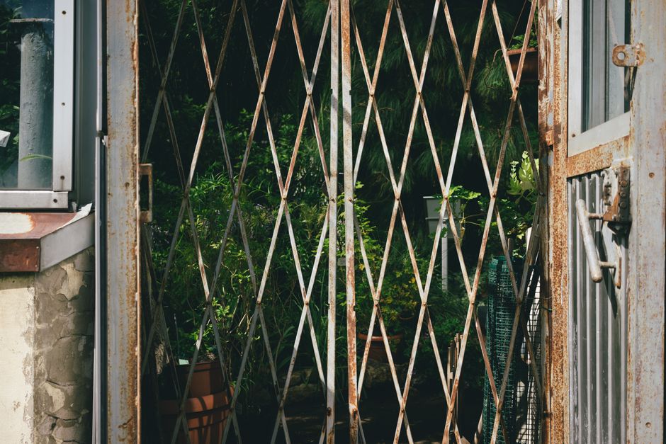 A wrought iron gate with curled detailing