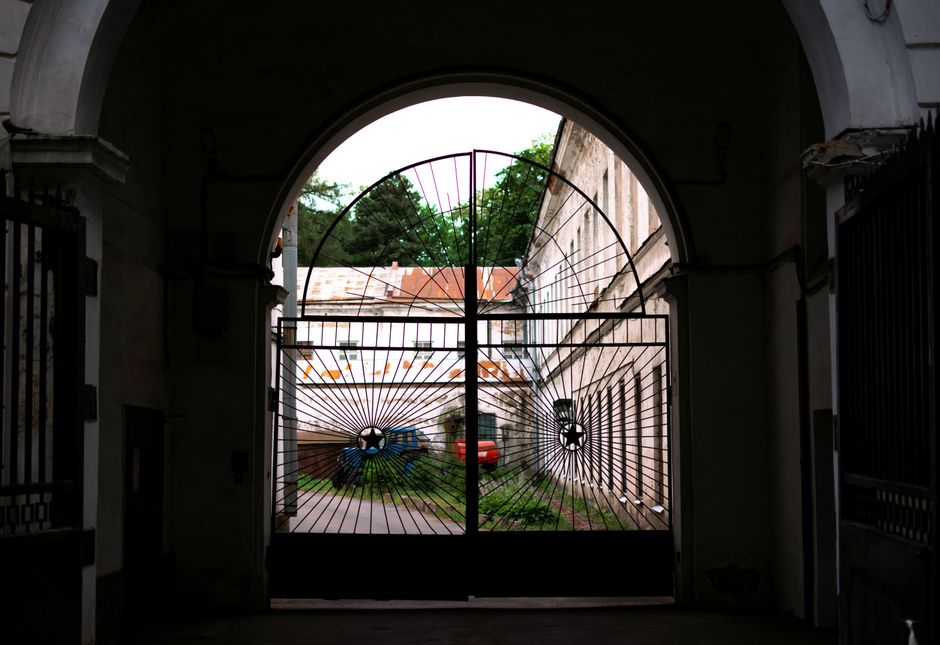 A metal gate with a lock and latch