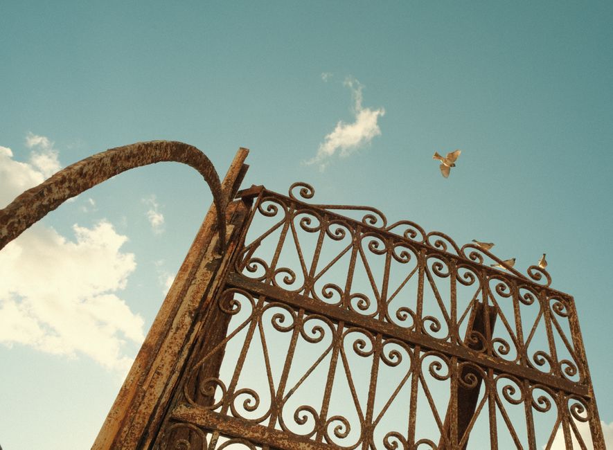 A closed iron gate set between two posts